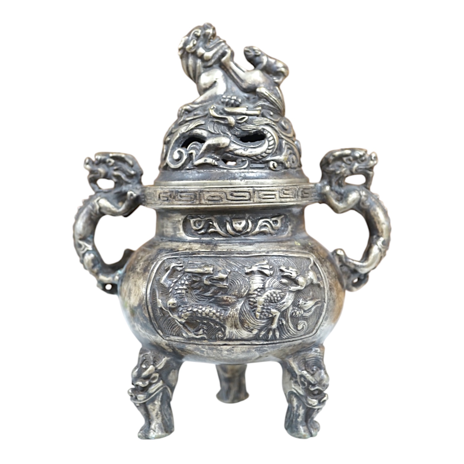 A Chinese silvered bronze lidded ‘dragon’ censer, 16cm tall. Condition - fair to good